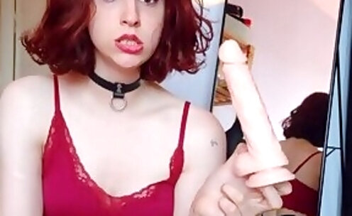 Gorgeous redhead trans-girl strips and rides her dildo