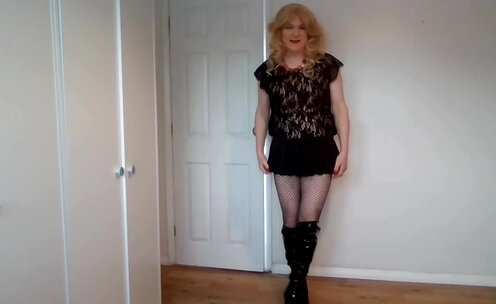 Black lacy fishnets, leather boots and minidress