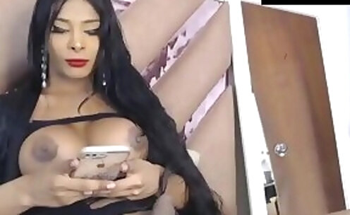 long haired latina tranny and juggs tugs her large cock