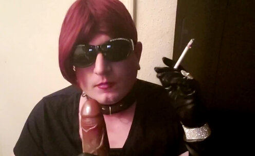Sissy slut Mndy smoking in leather gloves