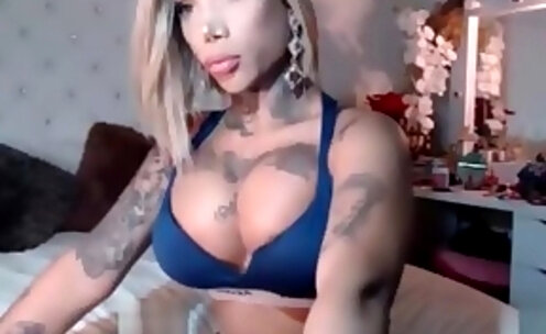 Blond shemale with huge tits masturbates for you