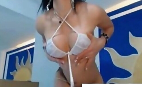 Gorgeous Strips and Plays with her Tits